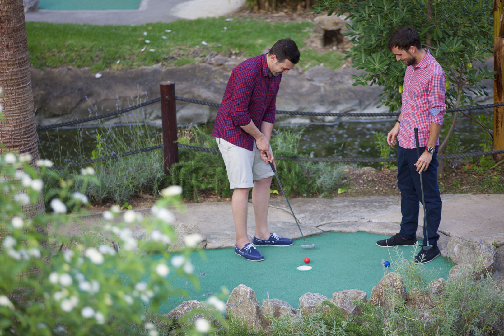 Boys playing golf