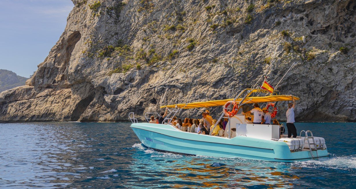 boat drives along the coast